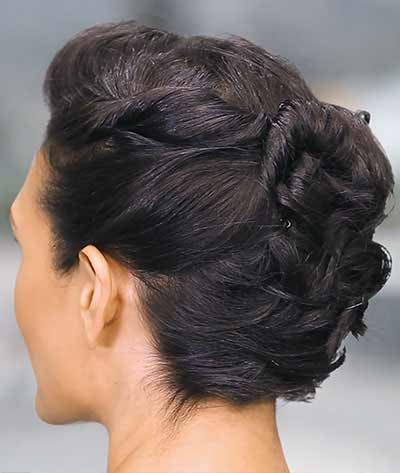 hair styled into an twist back updo with bobby pin - after